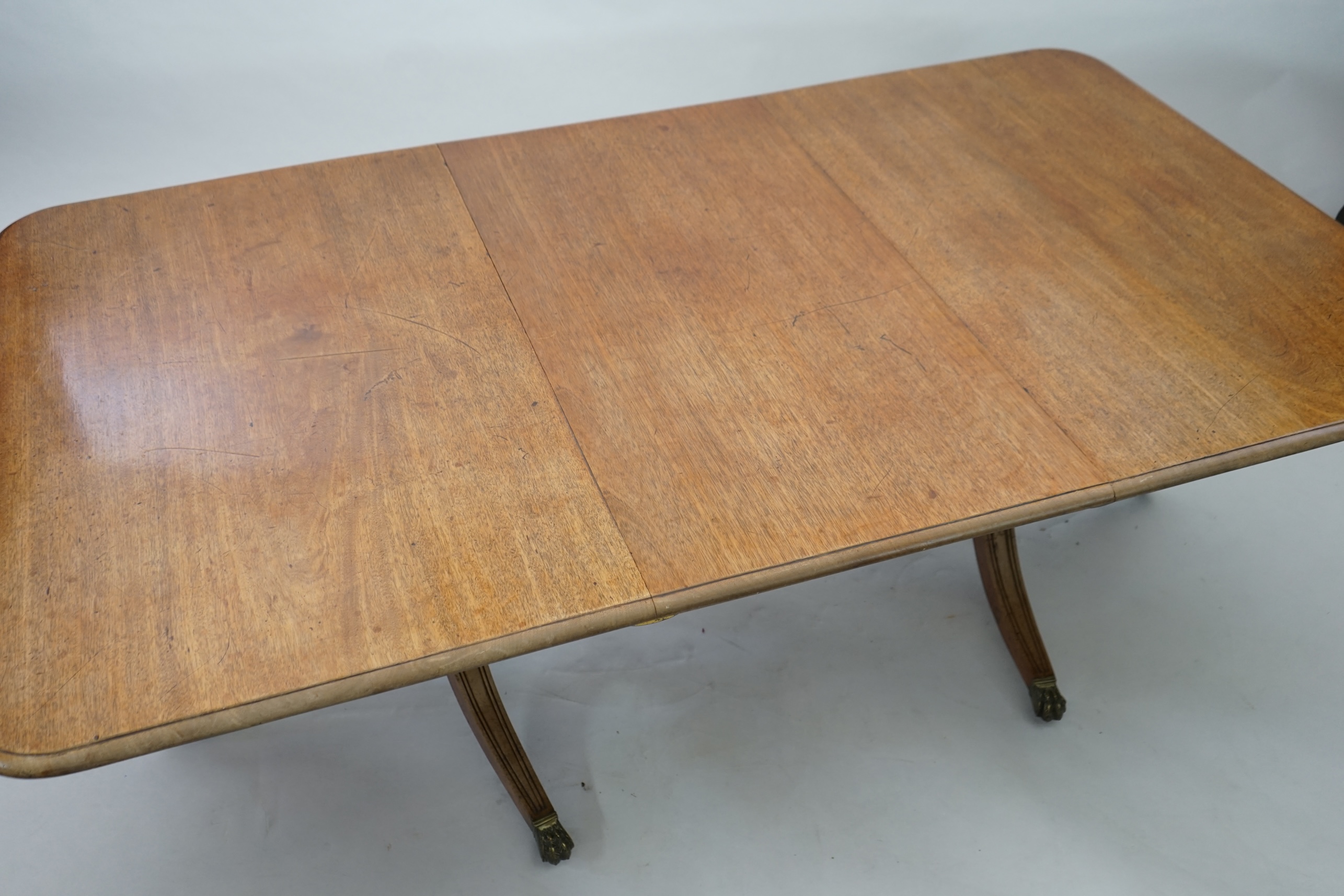 A Regency mahogany extending dining table